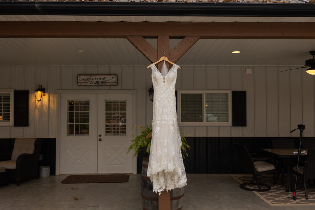 Wedding dress hanging from outside post at 2425 warehouse in Monroe, GA