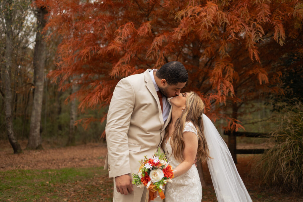 Bride and groom share their second kiss after their wedding ceremony during couples portraits