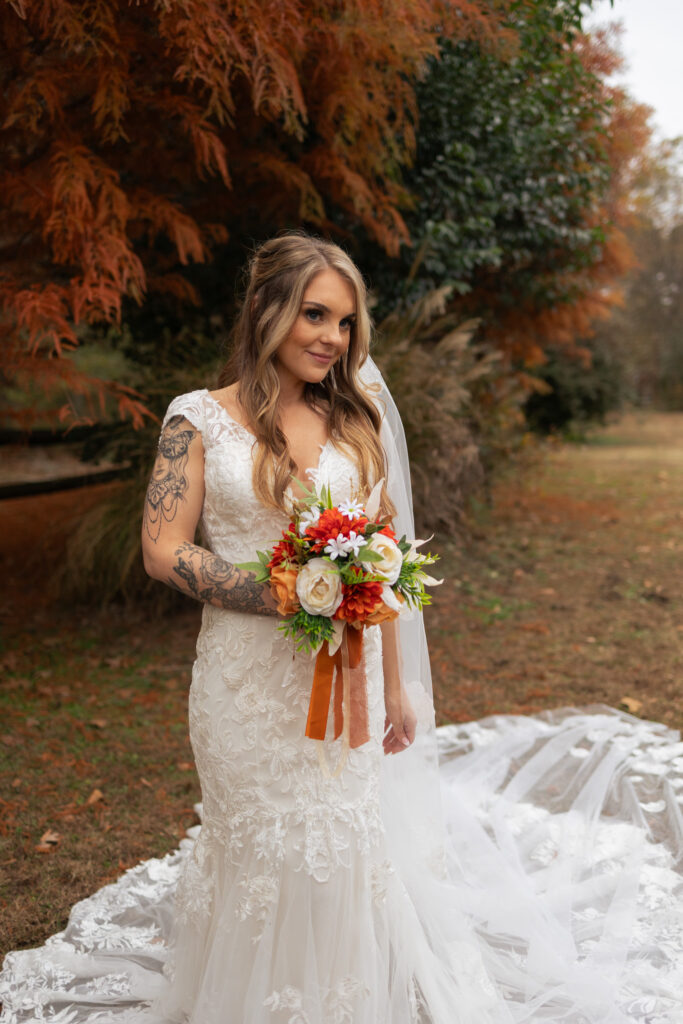 Autumnal wedding bouquet in bride's hands for bridal portraits at 2425 warehouse in Monroe, GA